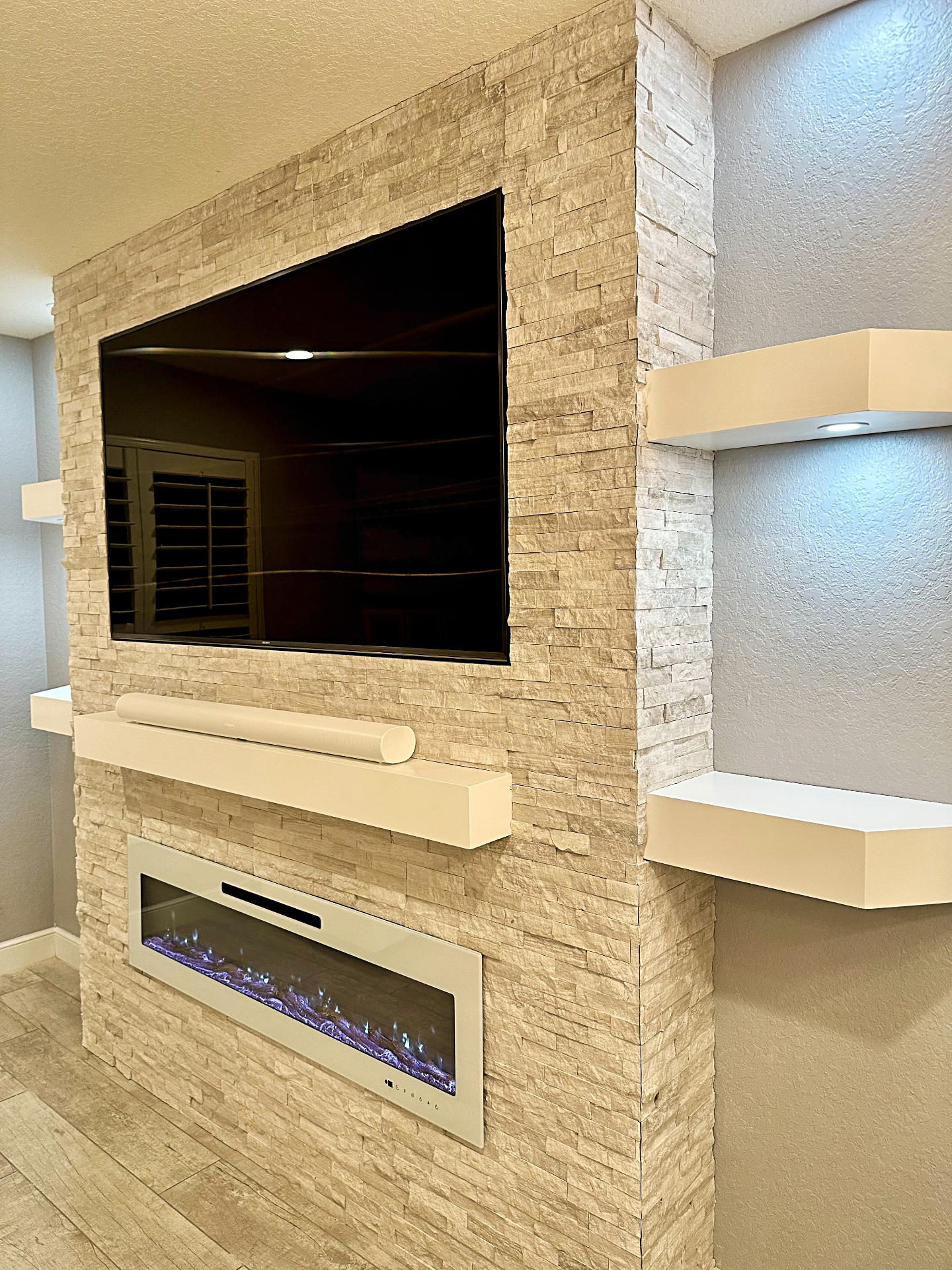 Custom Entertainment Wall – Fireplace, TV & Stacked Stone | Delray Beach, FL - Professional Home Improvement Project Image 1 by FL Handyman LLC